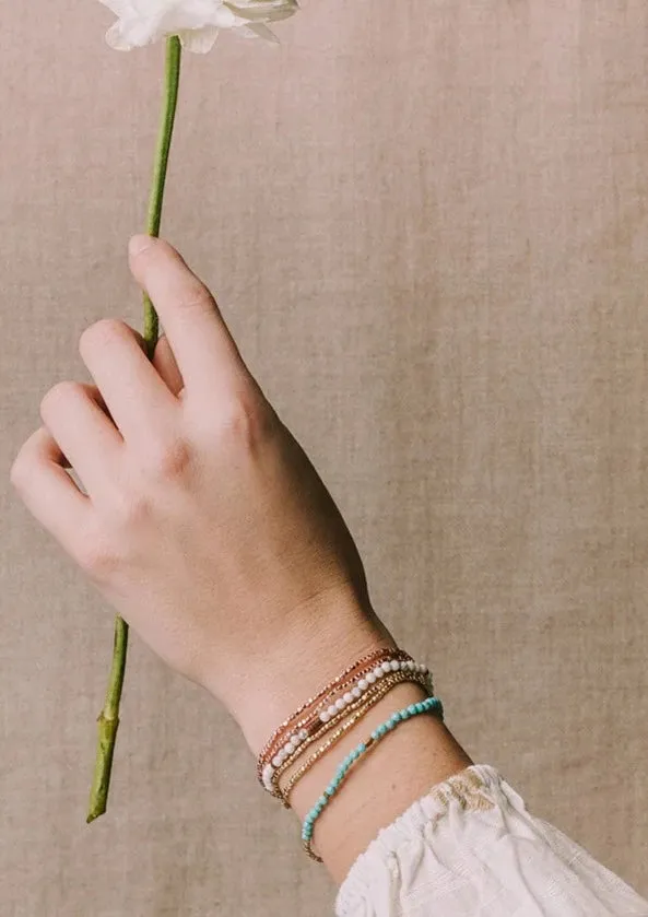 delicate nk/br turq