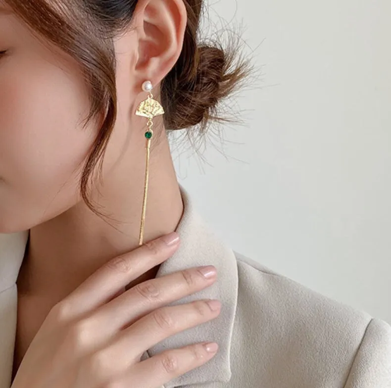 Gold oriental fan tassel earrings