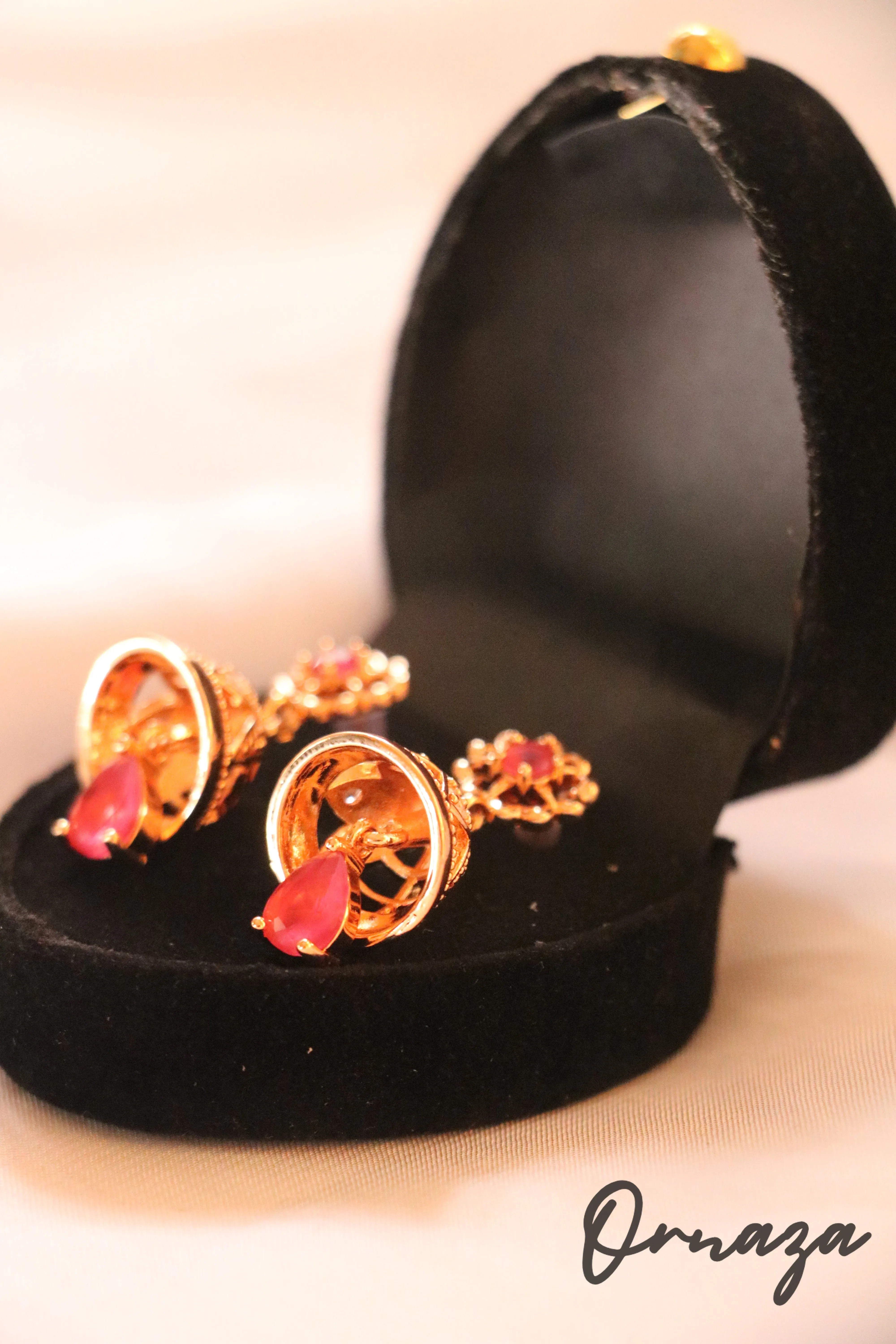 Gold-Plated Floral Jhumka Earrings with Ruby Red Accents – A Blend of Tradition and Elegance