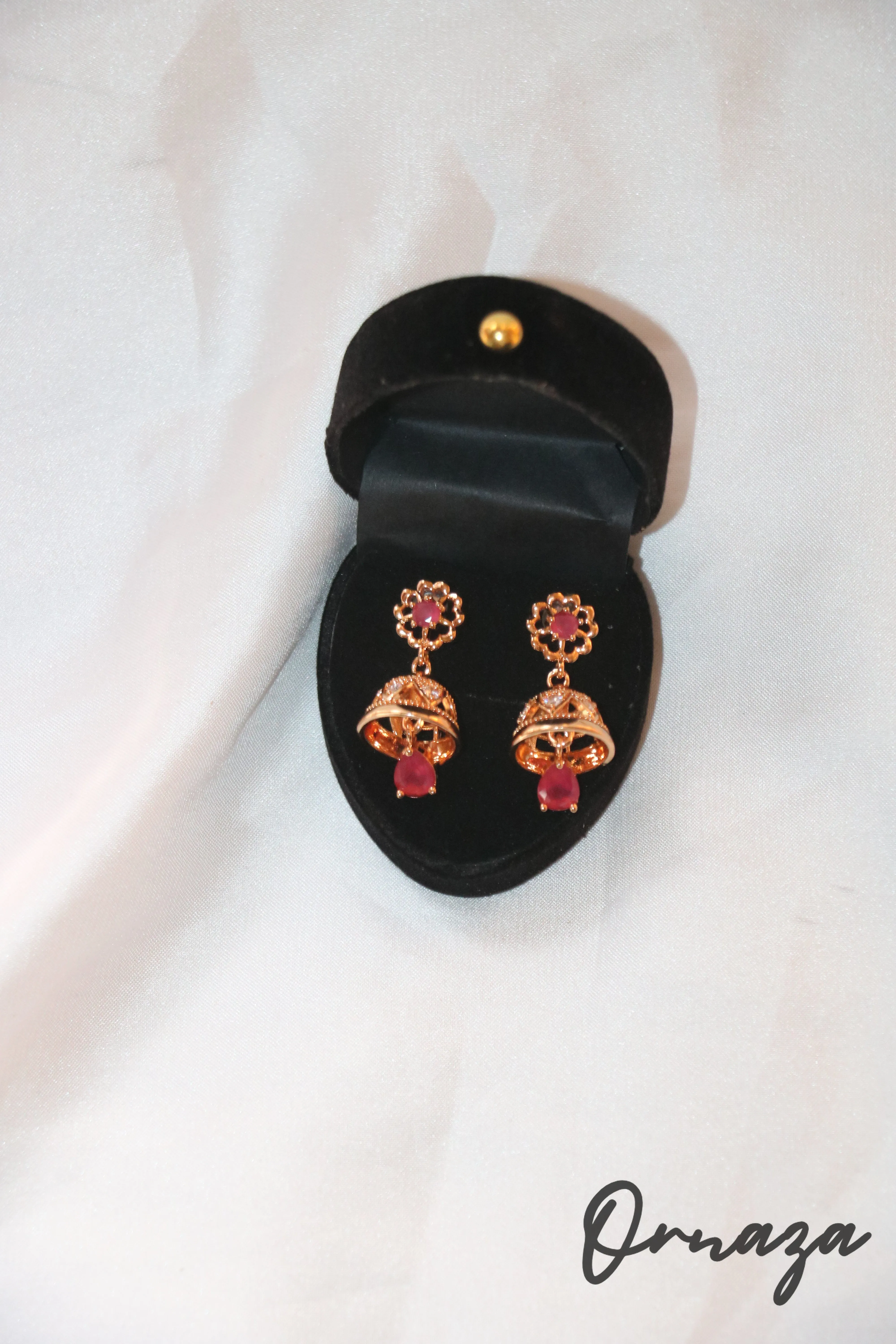 Gold-Plated Floral Jhumka Earrings with Ruby Red Accents – A Blend of Tradition and Elegance