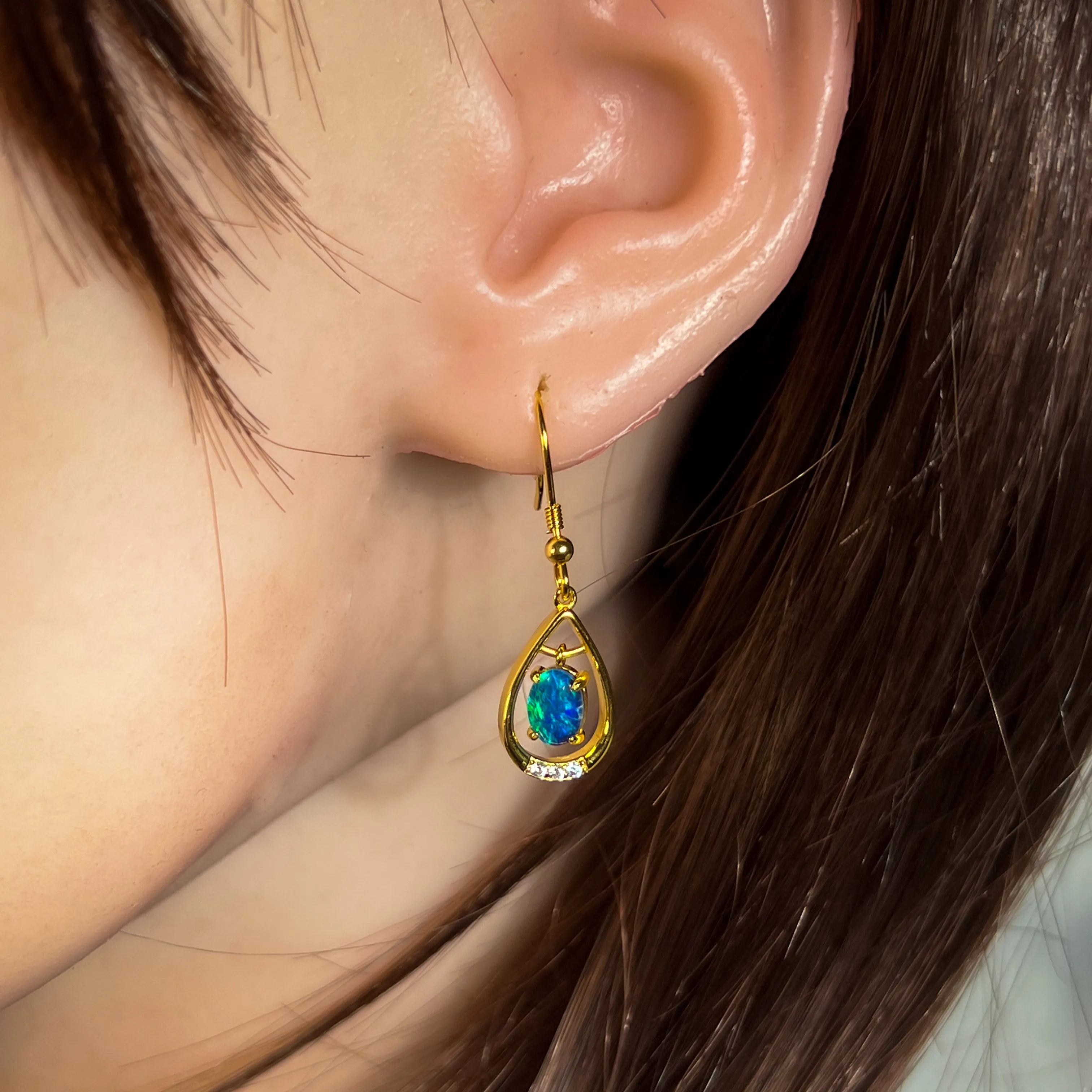 Gold Plated sterling Silver dangling pear shape earrings with two 7x5mm Opals