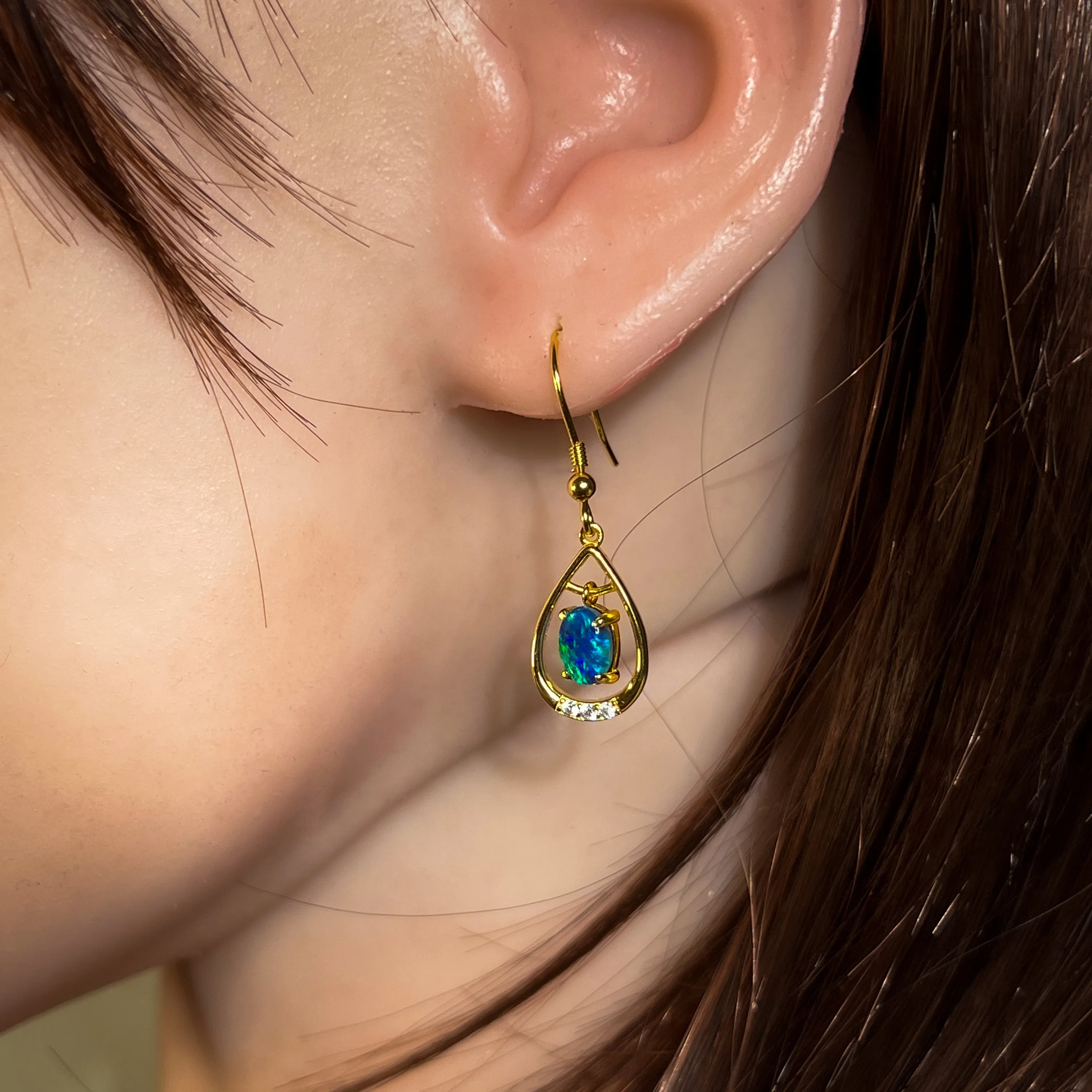 Gold Plated sterling Silver dangling pear shape earrings with two 7x5mm Opals